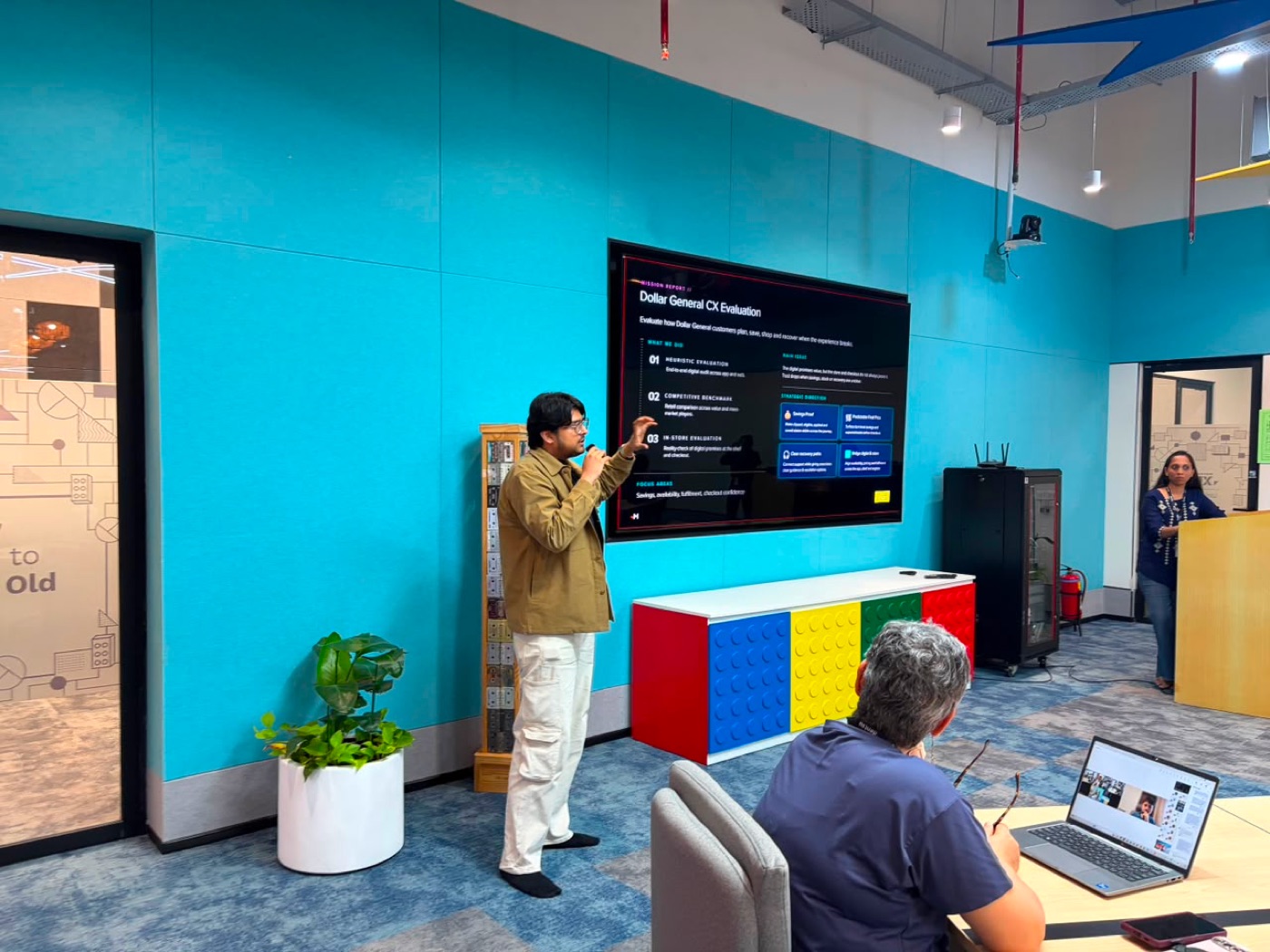 Akshat presenting a digital experience to a team