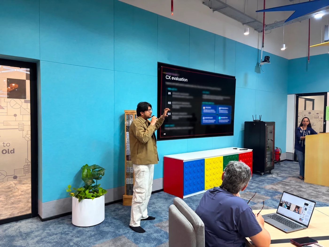 Akshat presenting a digital experience to a team