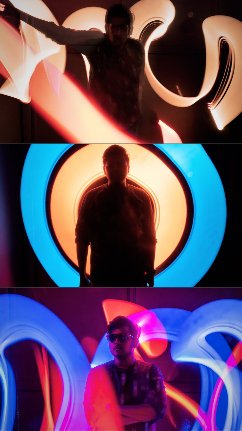 Akshat inside a colorful light installation