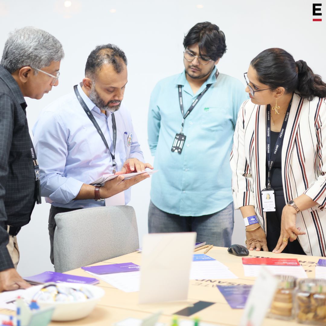 Akshat observing a team evaluate workshop material